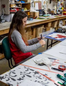 Engraphix Procurement Manager prepping signs for delivery