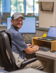 Sign Sales Representative working on sign bid package at engraphix architectural signage