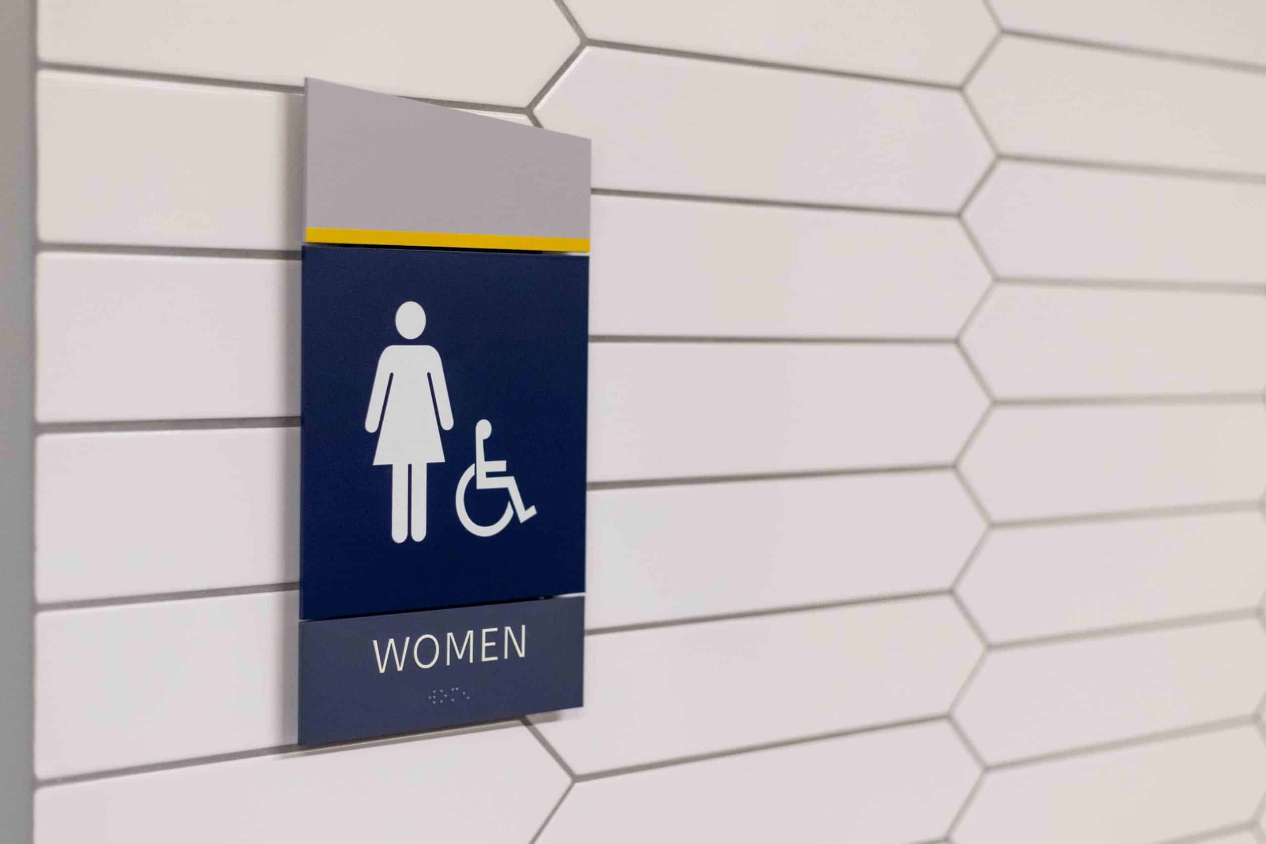 Custom restroom wayfinding sign rec center