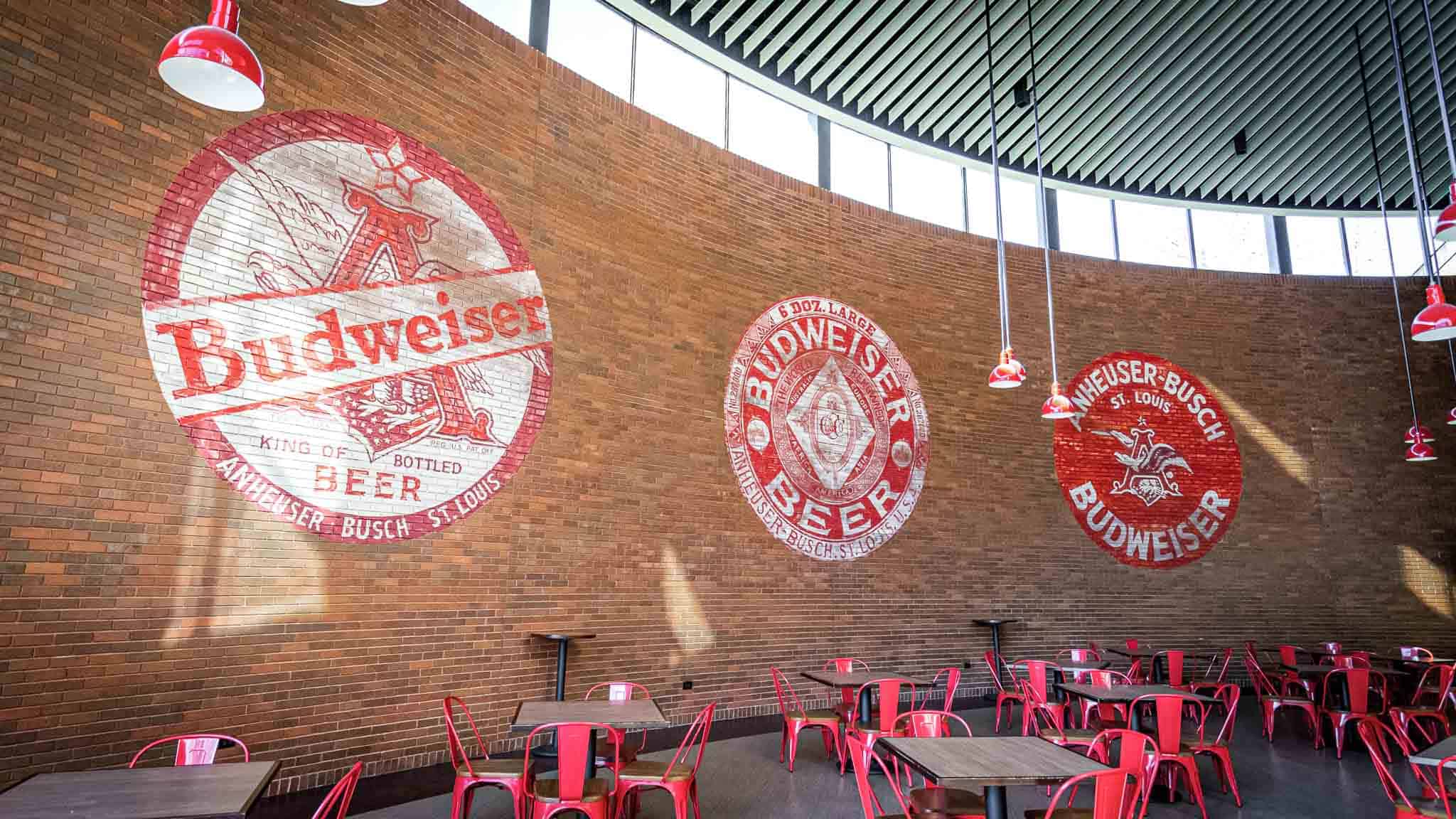 Red Hand painted Budweiser logos on brick wall at Anhueser-Busch's Headquarters