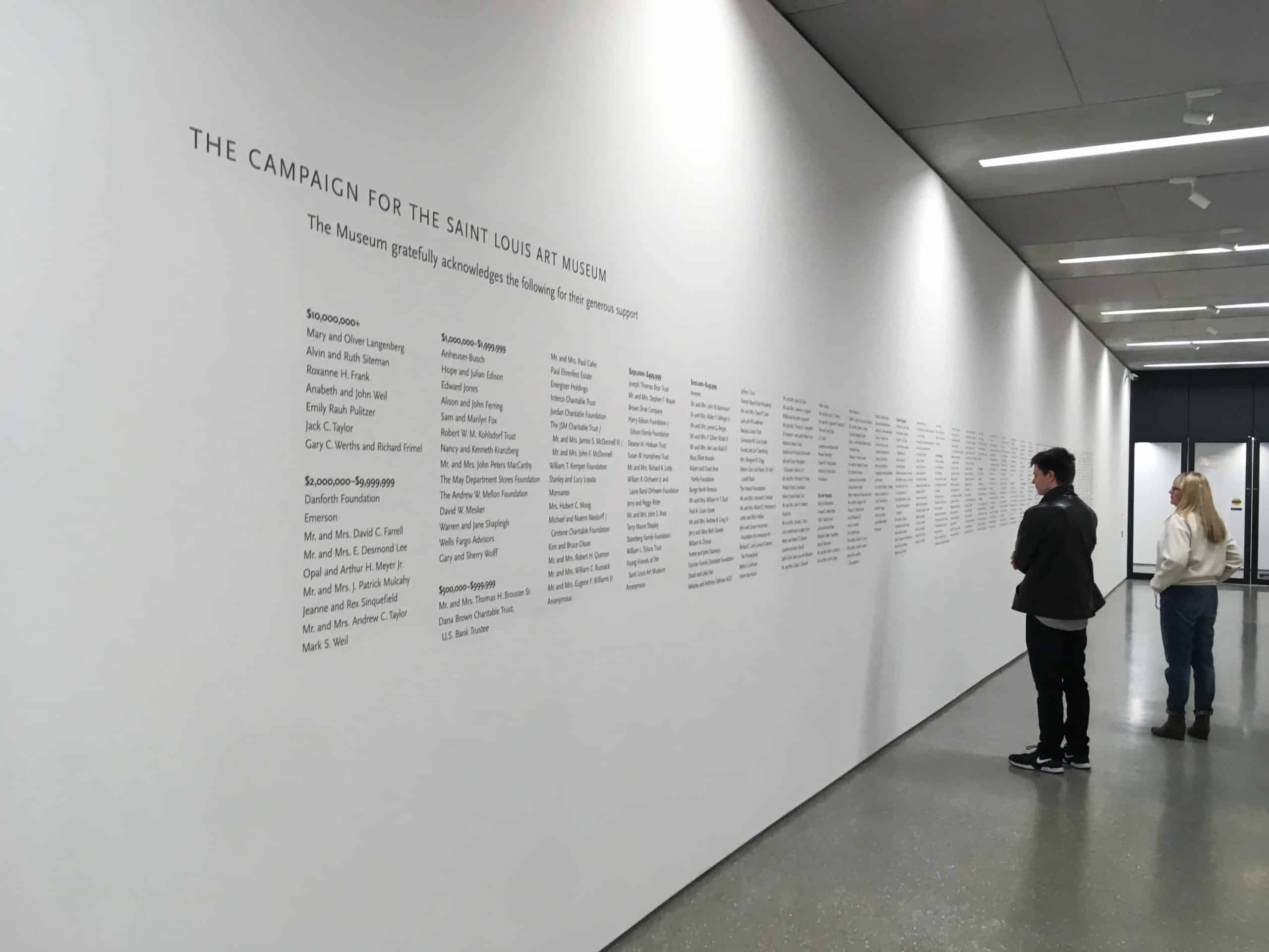 Art Museum Donor Recognition Wall with people looking at it