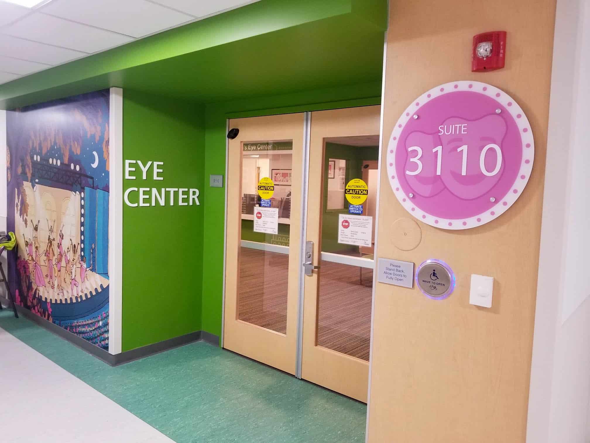 childres eye center entrance featuring playful signs and vinyl graphics