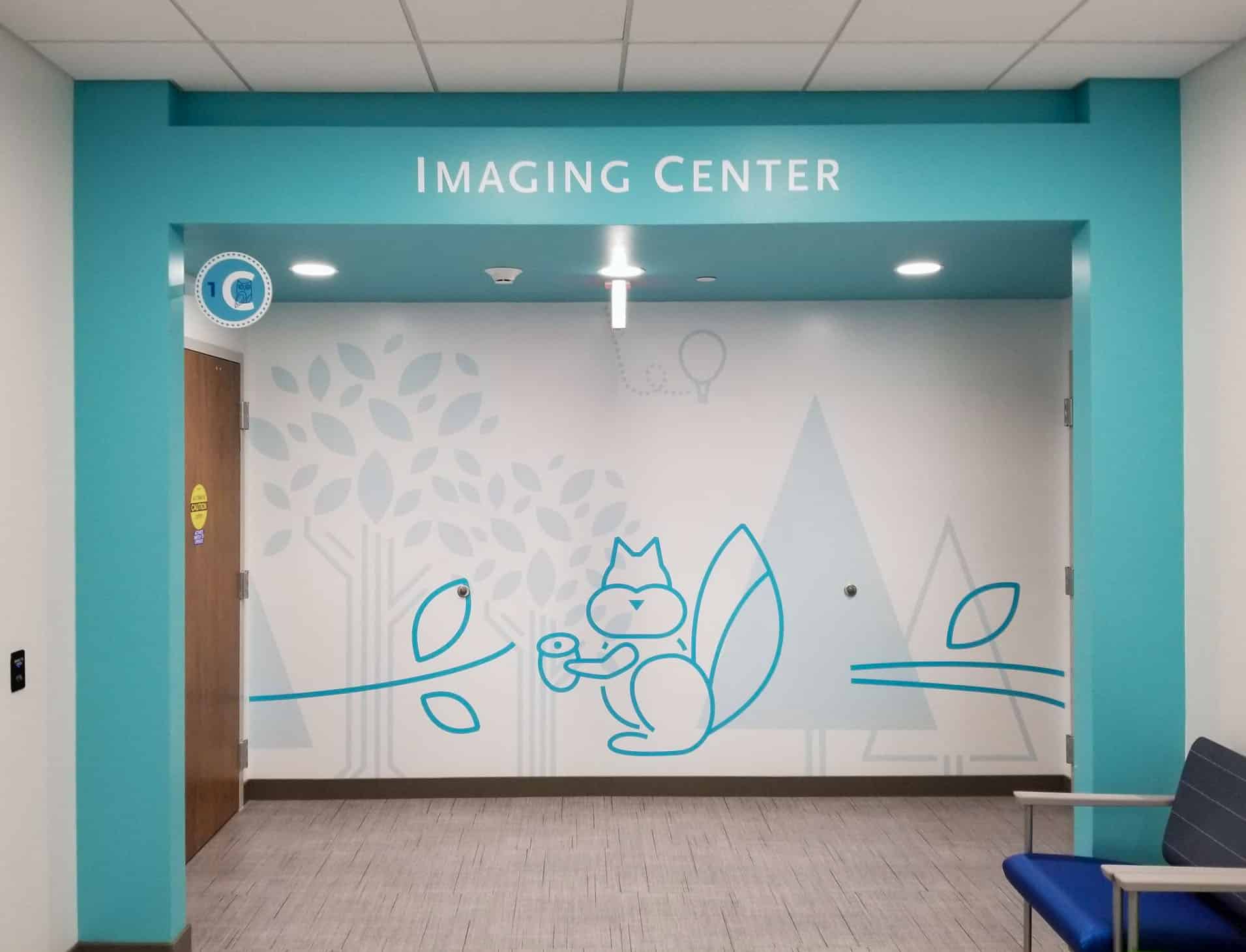 Dimensional letters and squirrel shaped vinyl decorating entrance to childrens imaging center