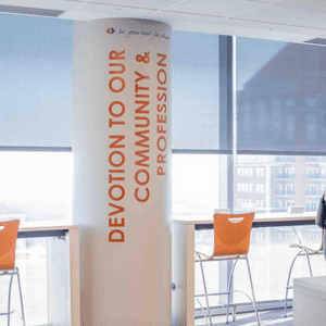 Vinyl stuck on curved column for office branding