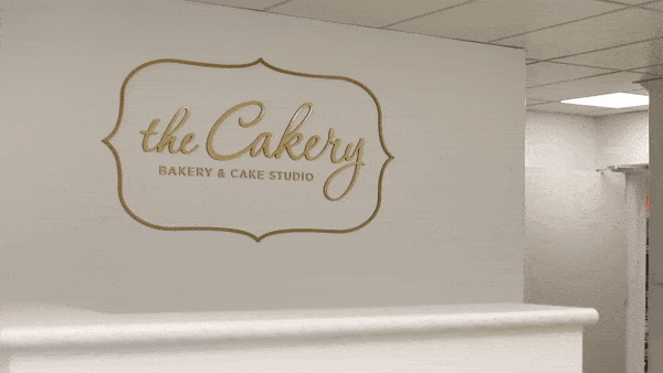 Video of Cakery Bakery Custom Gold Wall Logo Zooming in to show detail
