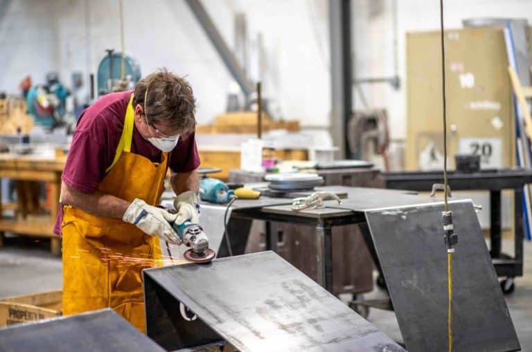 Engraphix Custom Fabricator Working on custom aluminum sign for university