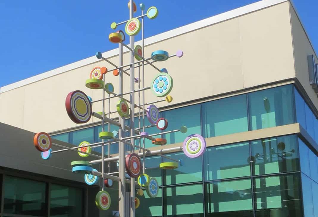 tree with colorful dots on the end of branches for playful sculpture at Mercy Hospital