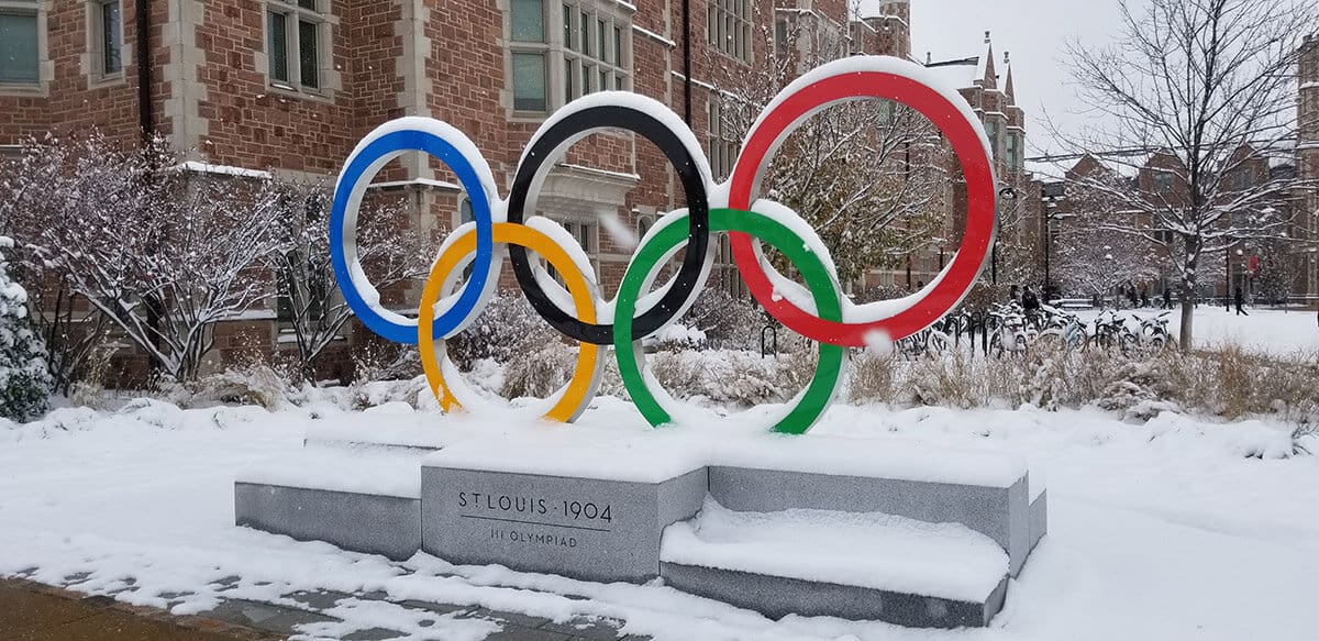 Olympic Ring Spectacular sculpture with concrete base covered in snow