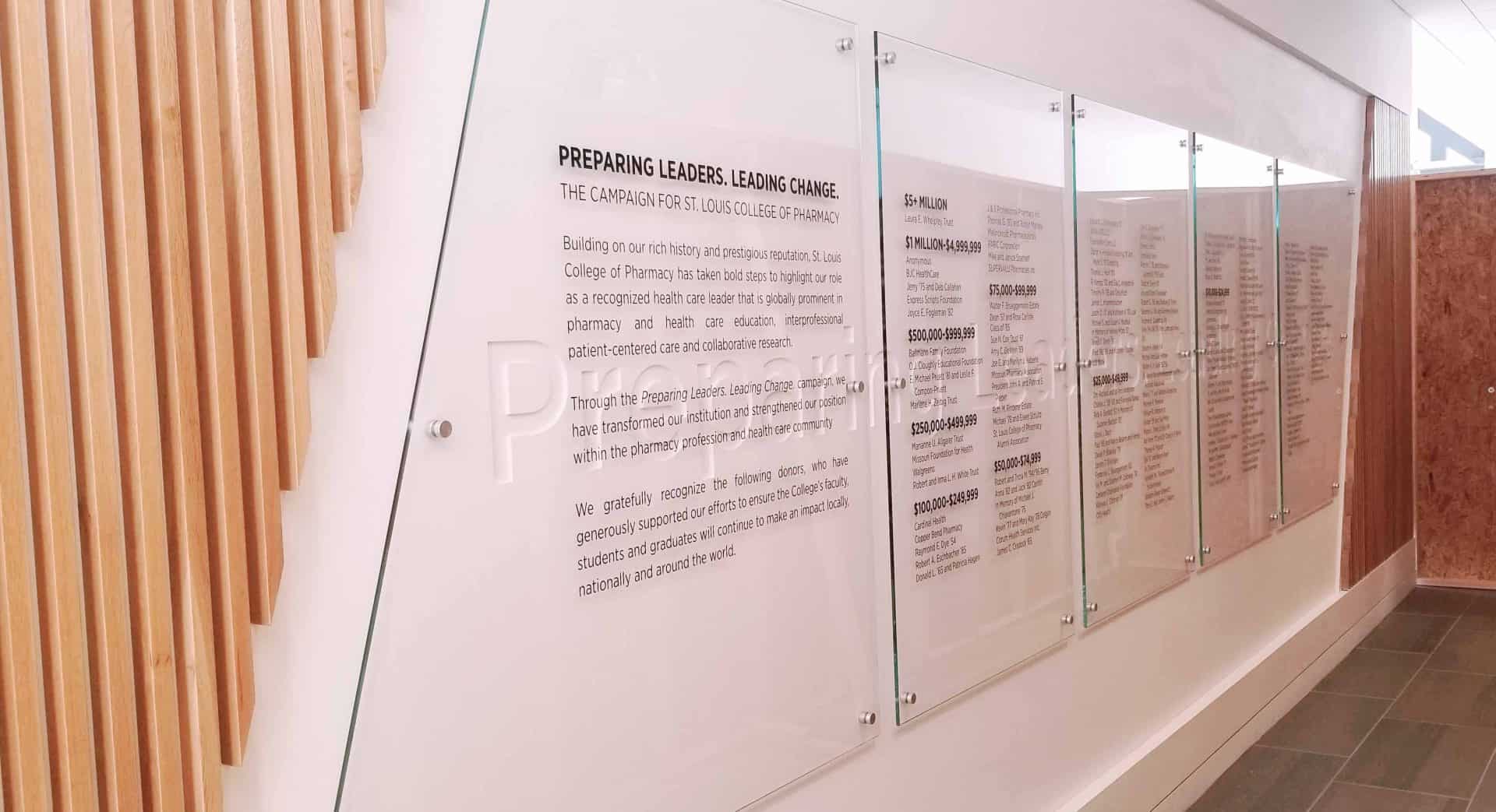 wood elements and glass panels in a donor recognition wall