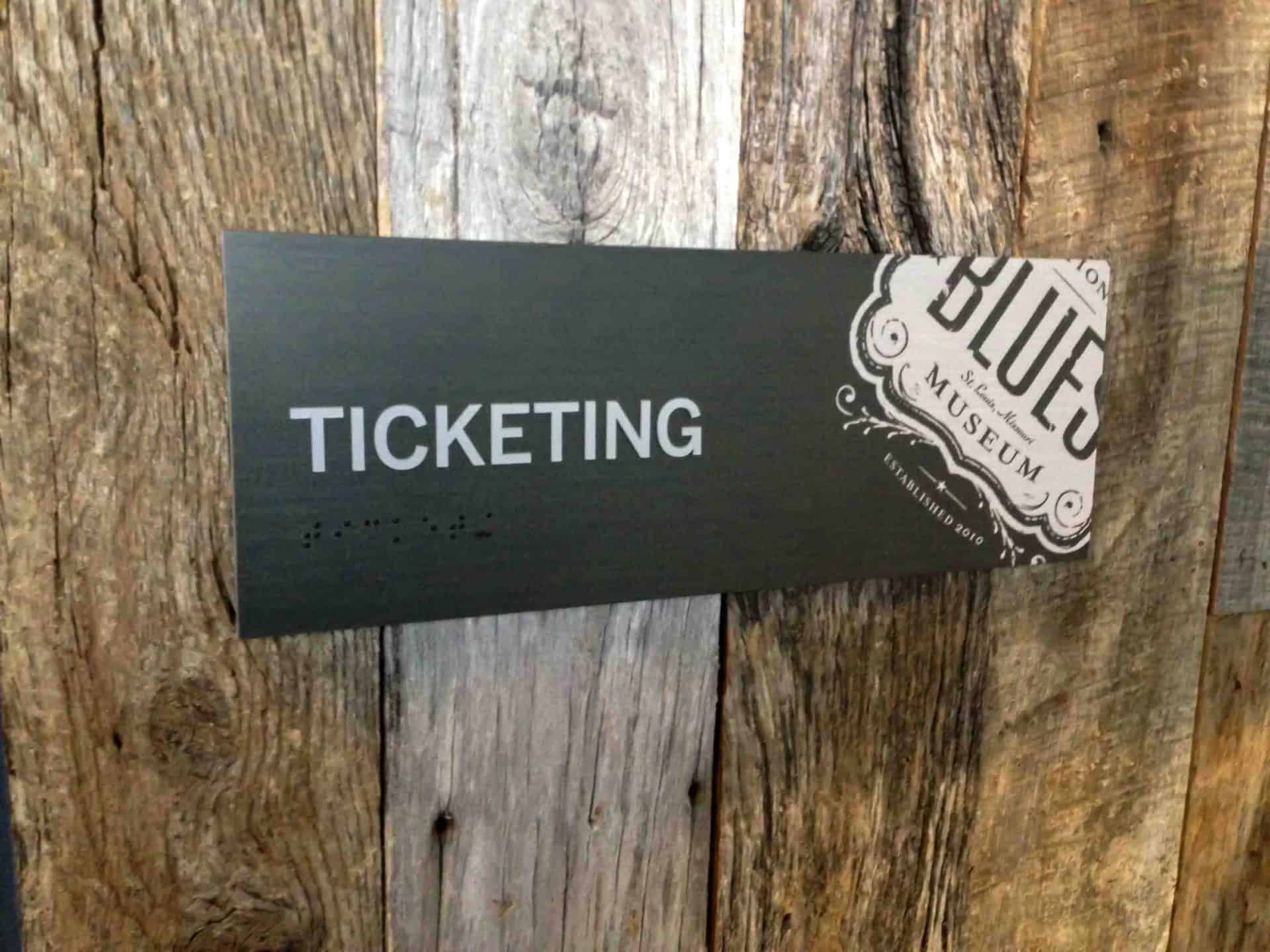 Custom ticketing office sign at the national blues museum installed on weathered wood