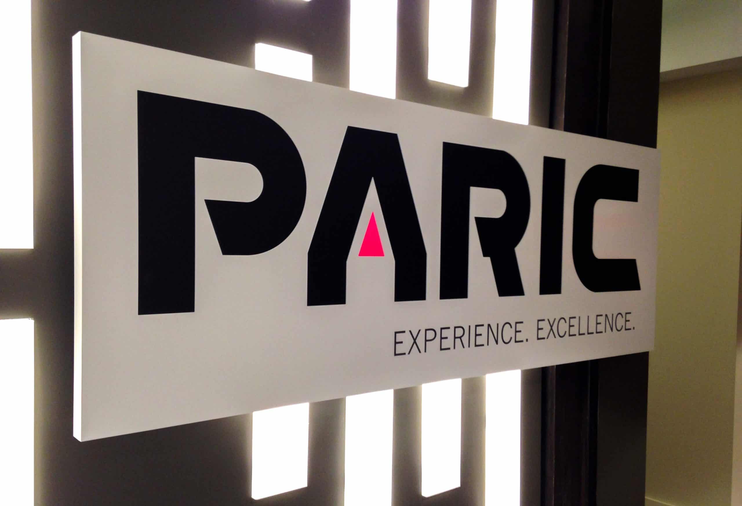 Paric panel logo sign lit with geographic lights