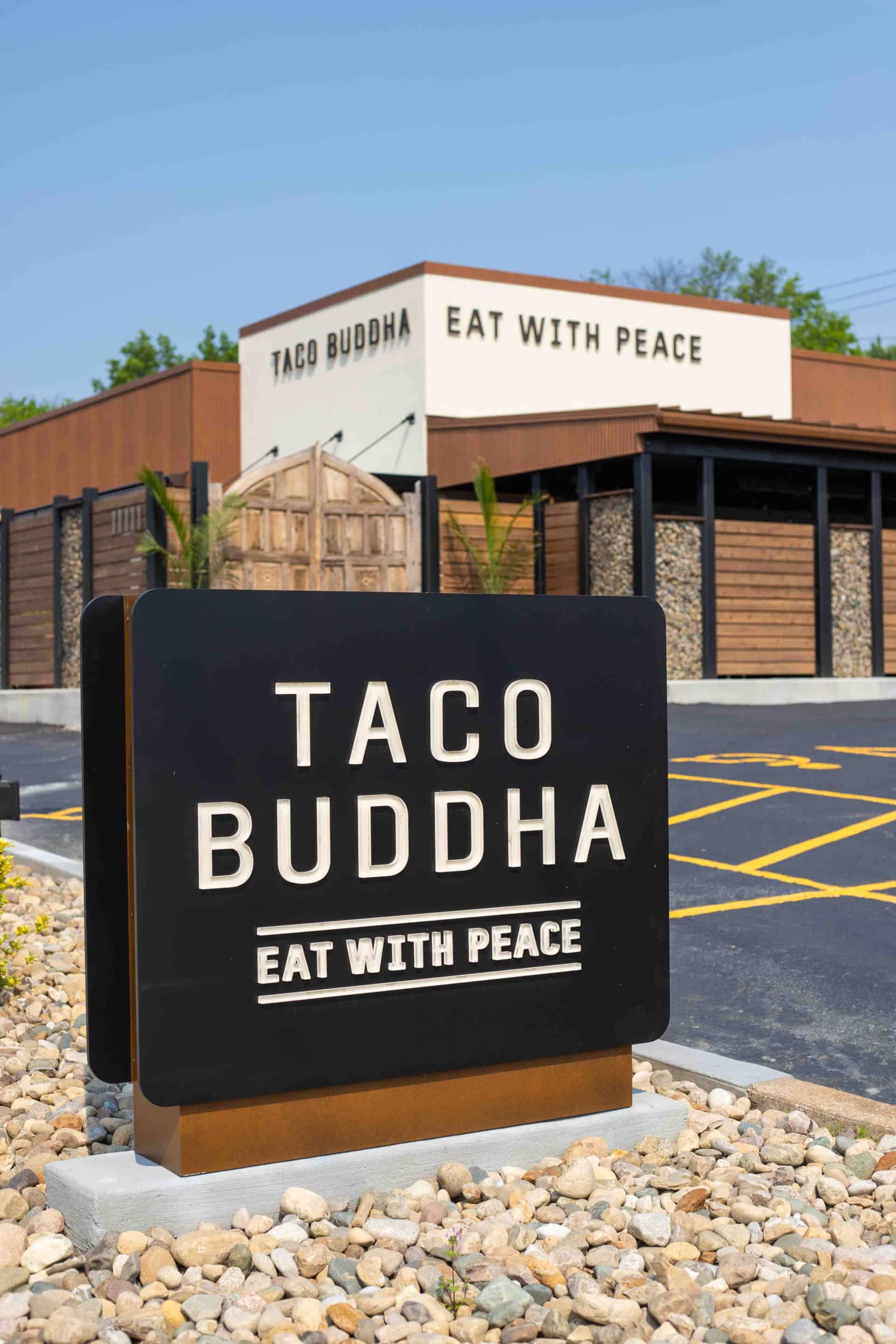 Custom black monument sign with dimensional letters that light up