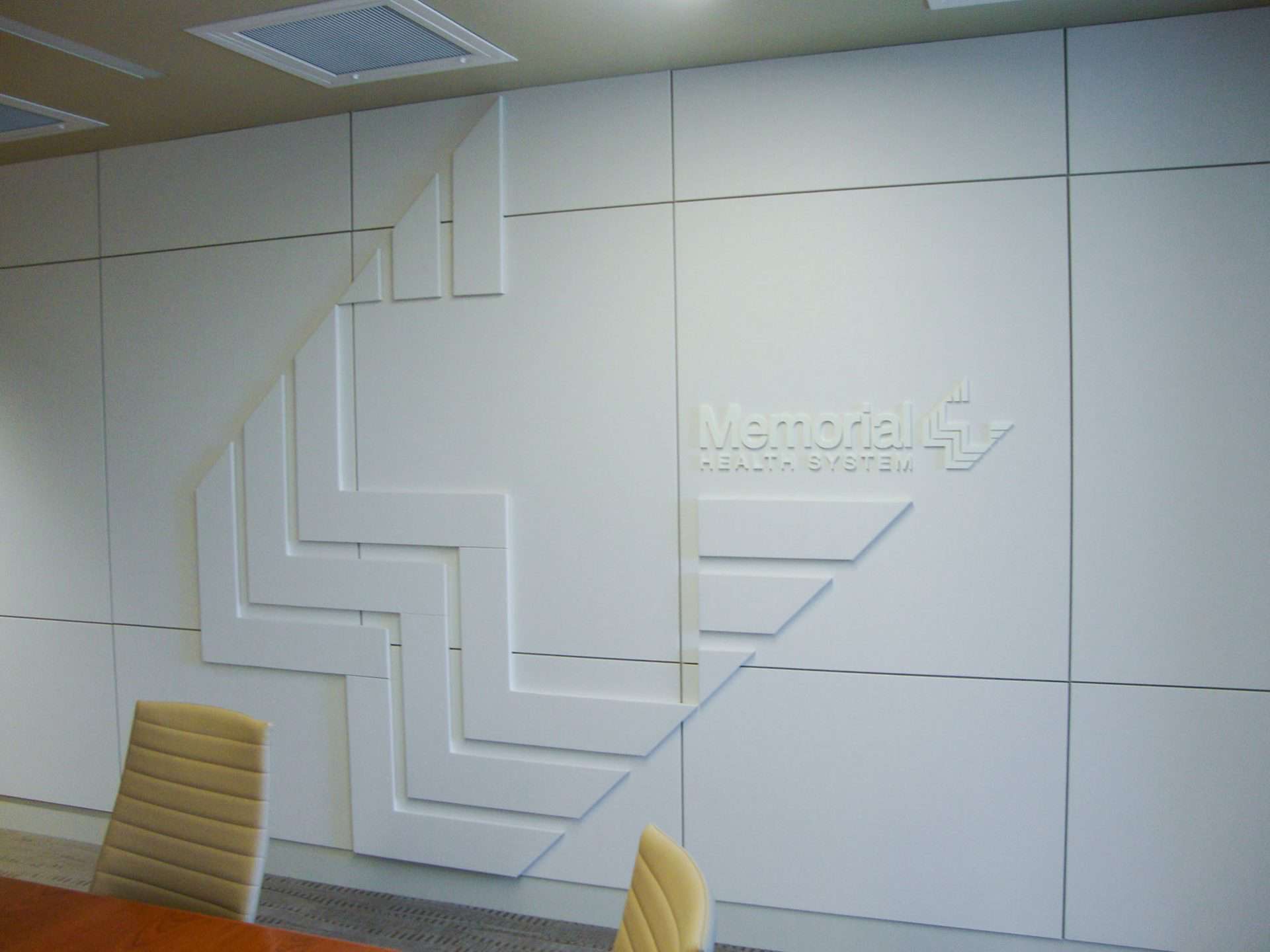 White on white dimensional logo graphics for Memorial Health systems Corporate office