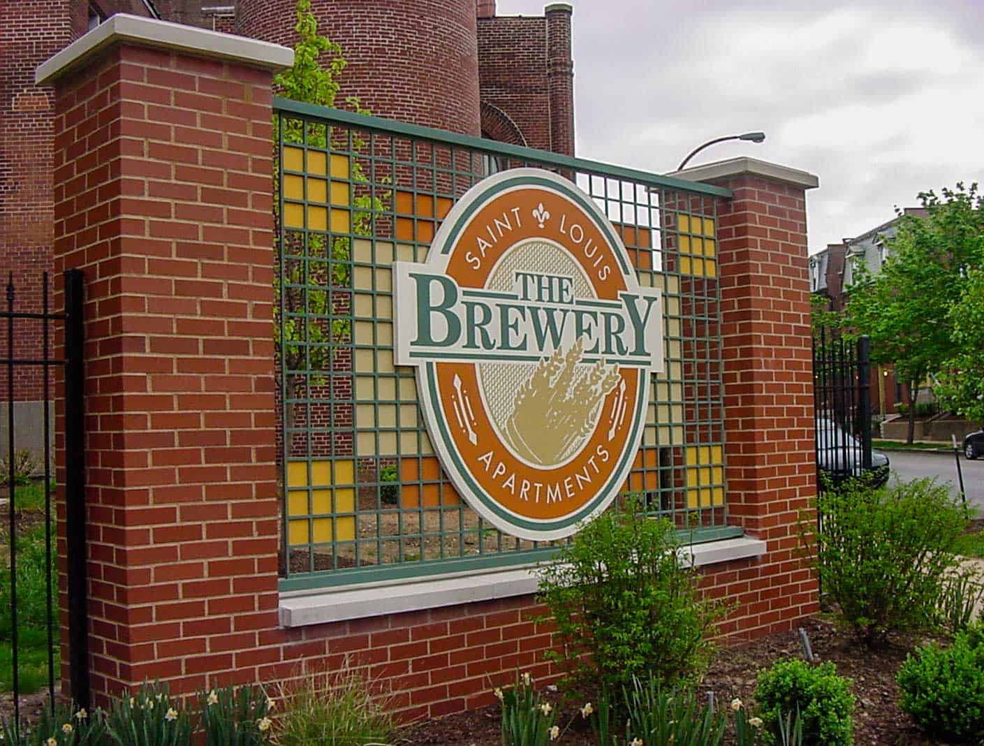 Custom monument sign for the Brewery featuring brick and metal base with custom dimensional logo