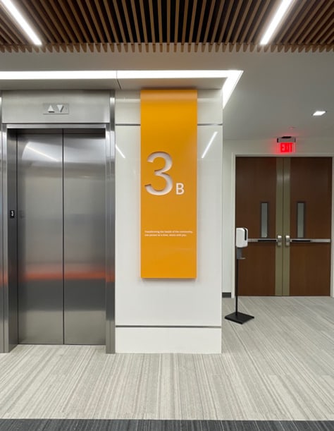 Elevator and floor panel noting floor and area of Centene office building