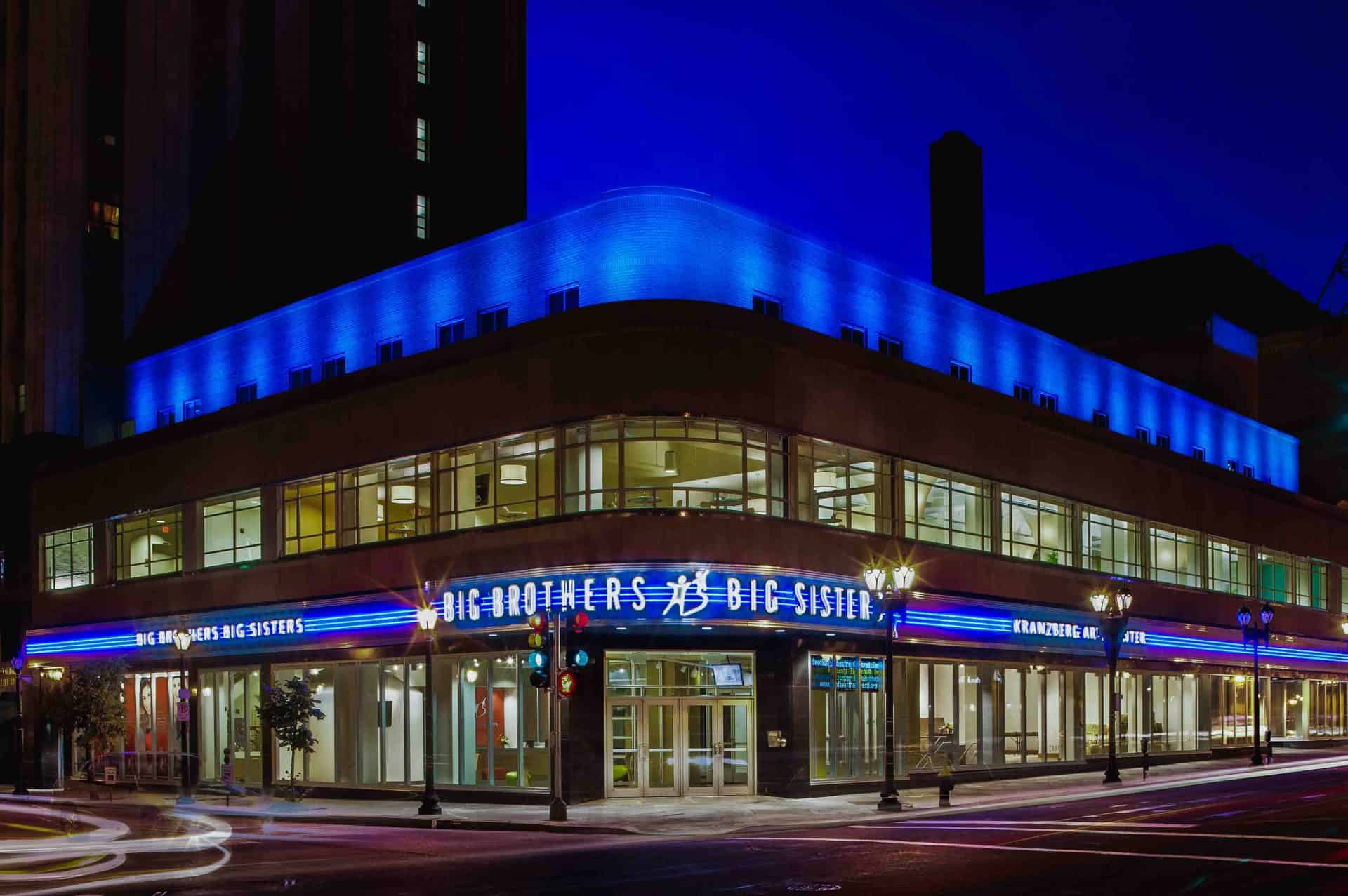 Blue Neon Building Signs for Big Bothers Big Sisters Nonprofit