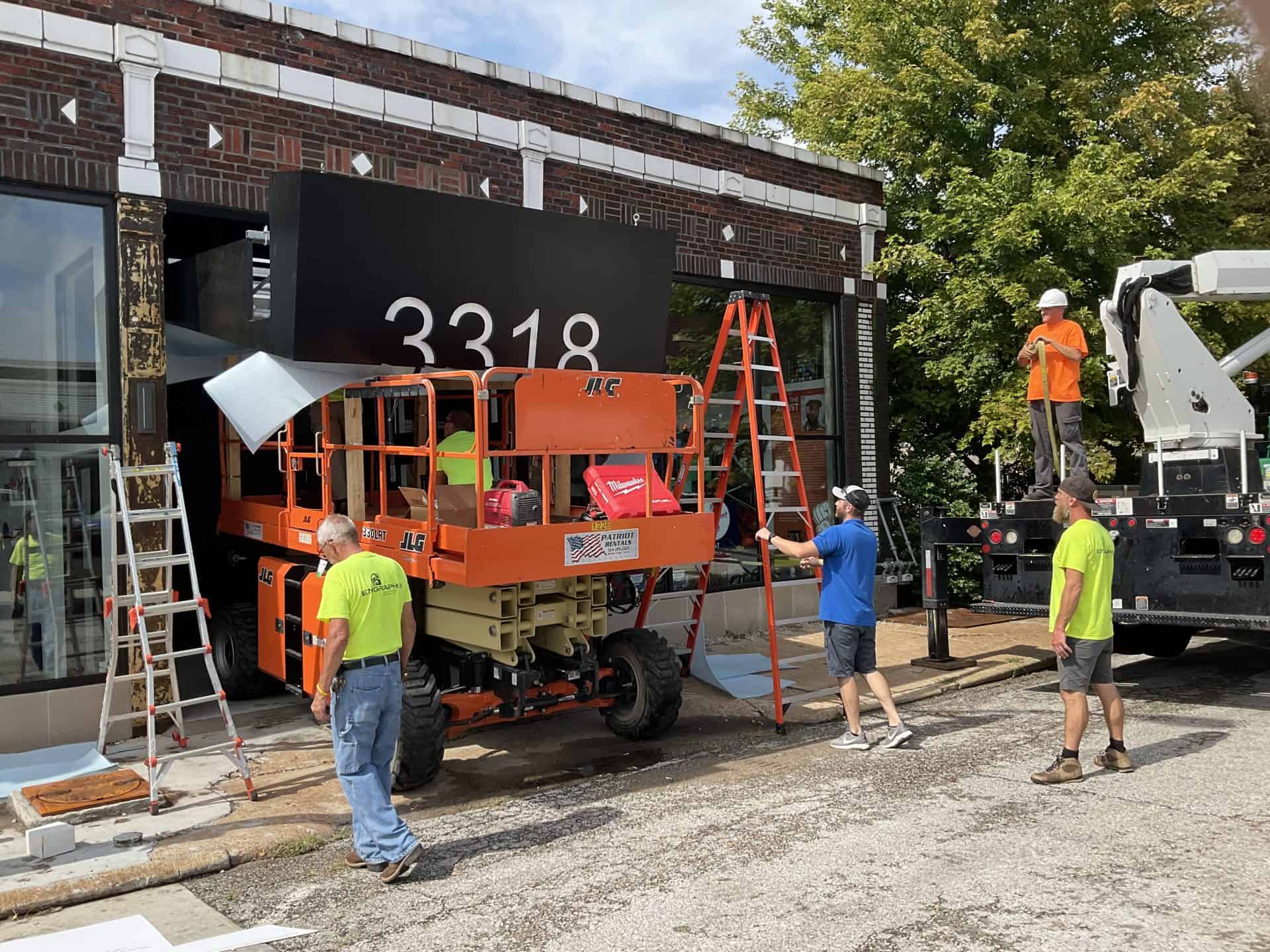 Engraphix installing custom address sign for art studio