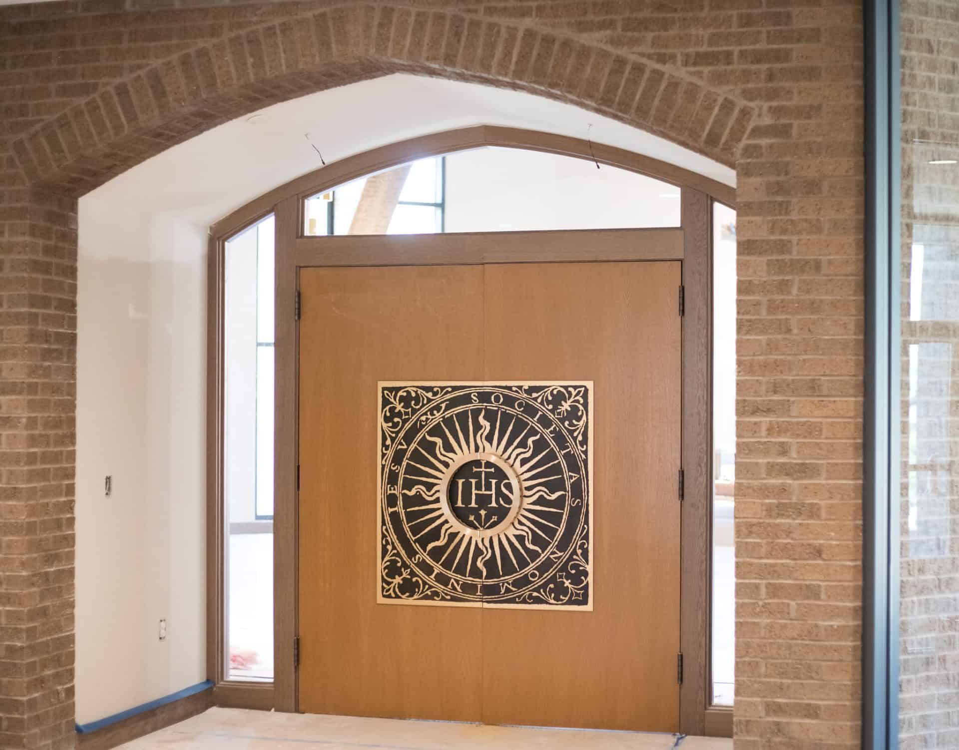 Jesuit hall door knob custom etched logo