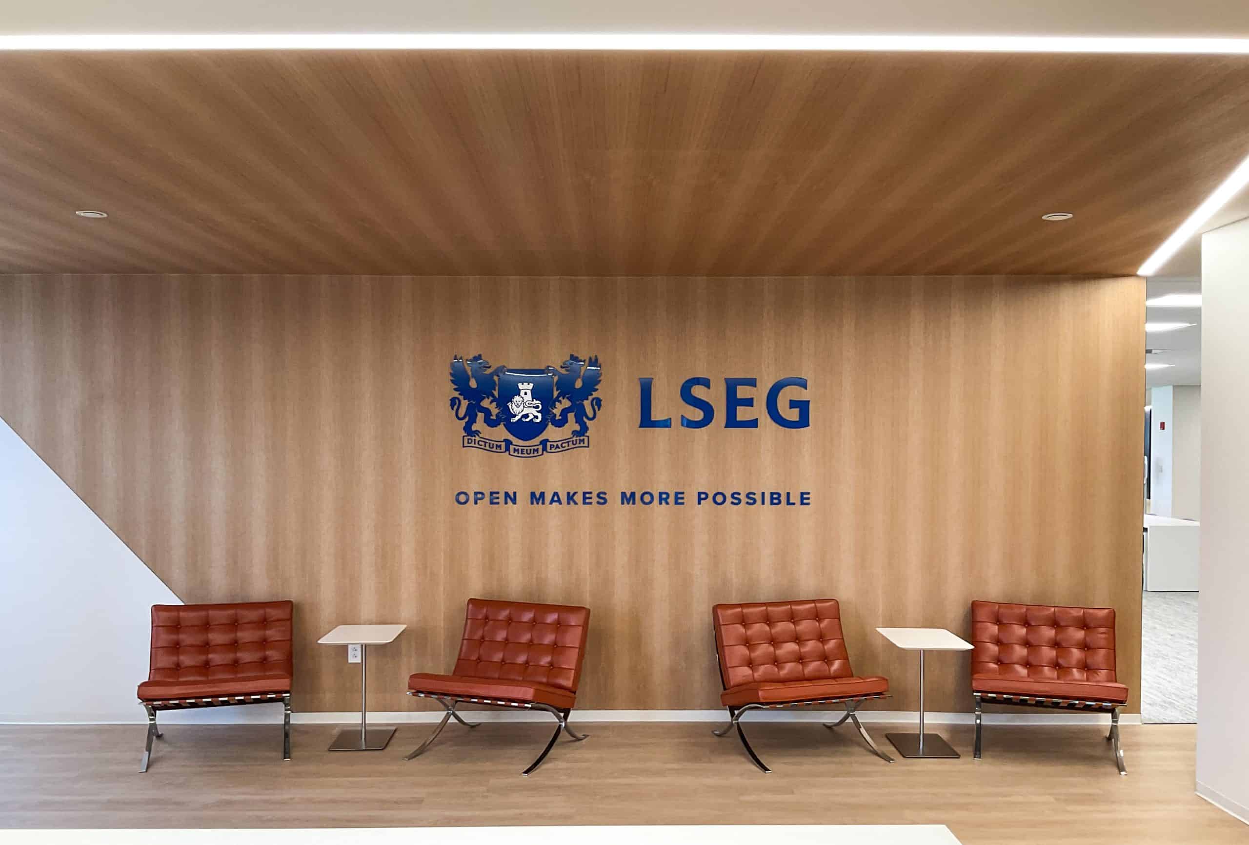 Dimensional blue logo for LSEG against wood wall