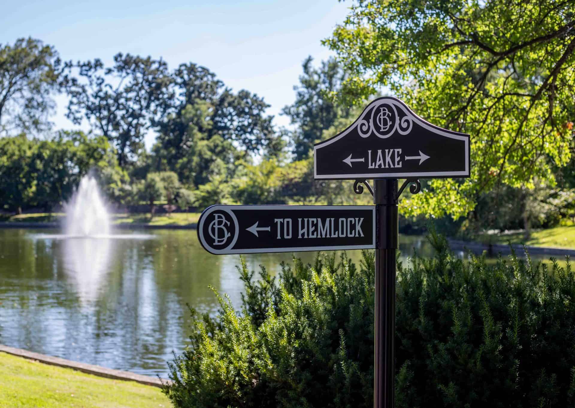 directional signs for cemetery and arboretum