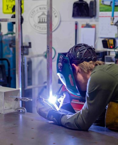 Engraphix Fabrication team welding together sculpture frame